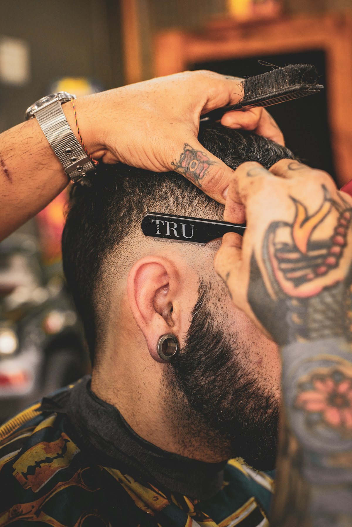 Close-up detail work along a client's hairline